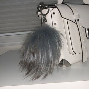 Michael Kors Large Fluff ball. Slate blue with grey ends & silver hardware.